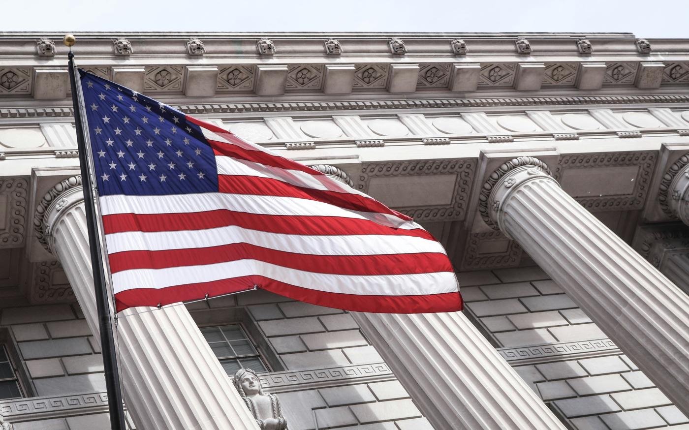 USA flag near municipal building by Brandon Mowinkel courtesy of Unsplash.