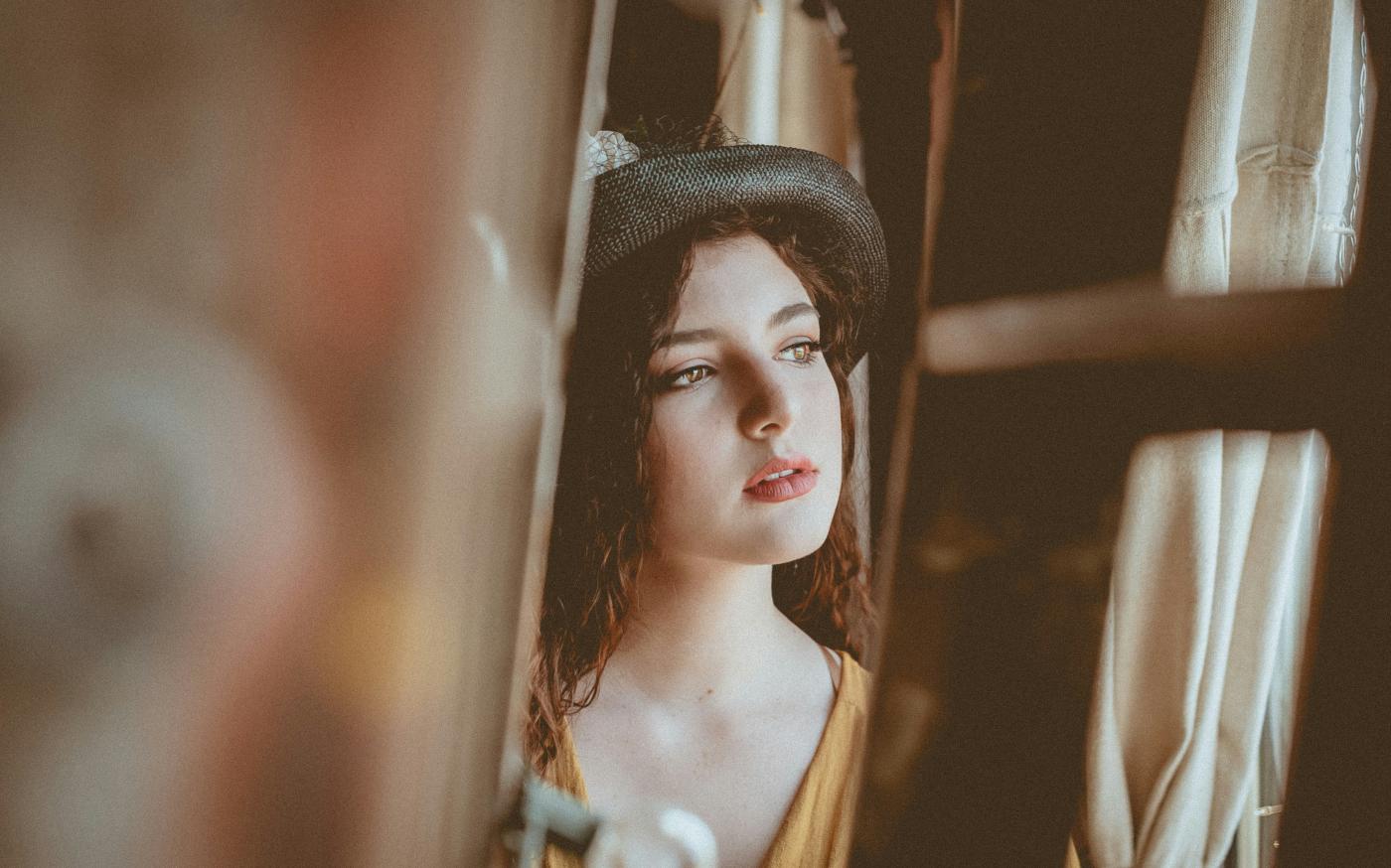 woman in black and white knit cap by Randy Jacob courtesy of Unsplash.