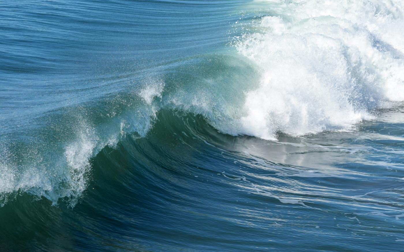 aerial view photography of waves by Pamela Heckel courtesy of Unsplash.