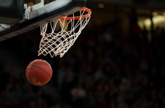 ball under basketball ring by Markus Spiske courtesy of Unsplash.