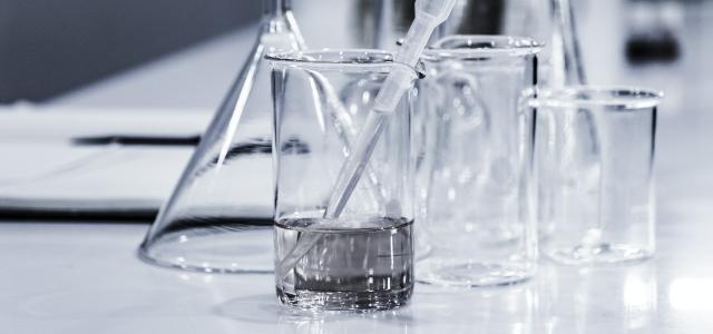 three clear beakers placed on tabletop by Hans Reniers courtesy of Unsplash.
